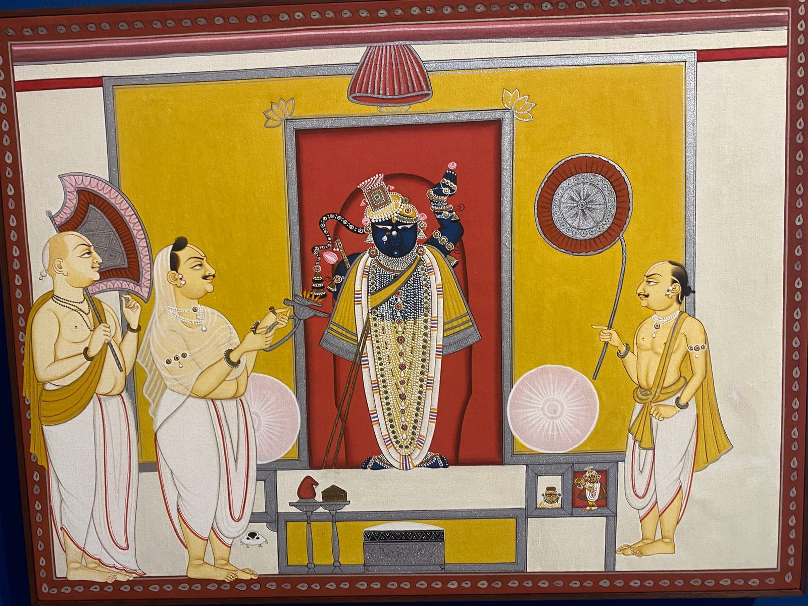 Pichvai painting of Shrinathji attended by priests at the Nathdwara shrine